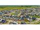 Aerial view of neighborhood showcasing a pool and vibrant, modern homes at 9769 E 62Nd Dr, Denver, CO 80238