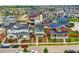 Aerial view of a neighborhood showcasing vibrant homes, streetscapes, and landscaping at 9769 E 62Nd Dr, Denver, CO 80238
