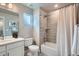 A clean bathroom featuring a shower-tub combination, toilet, and single sink vanity at 9769 E 62Nd Dr, Denver, CO 80238