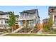 Charming two-story home boasts a welcoming porch, balcony, and well-manicured front yard at 9769 E 62Nd Dr, Denver, CO 80238
