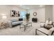 A living room featuring modern decor, a plush couch, and stylish furniture at 9769 E 62Nd Dr, Denver, CO 80238