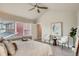 Bright bedroom with vaulted ceiling, large windows, modern decor, and lots of natural light at 9769 E 62Nd Dr, Denver, CO 80238