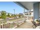 Lovely porch with a view of the landscaped street and neighboring homes in a vibrant community at 9769 E 62Nd Dr, Denver, CO 80238