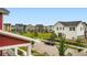 Street view of a neighborhood with many colorful modern homes and well-manicured landscaping at 9769 E 62Nd Dr, Denver, CO 80238
