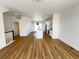 Open-concept living space with modern kitchen, sleek hardwood floors, and ample natural light at 2668 W 68Th Ave, Denver, CO 80221