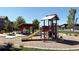 Community playground featuring a covered slide and picnic tables for outdoor enjoyment at 2668 W 68Th Ave, Denver, CO 80221