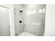 Sleek glass enclosed shower with modern fixtures and tiled walls for a luxurious feel at 2668 W 68Th Ave, Denver, CO 80221