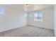 Bedroom features neutral carpet, recessed lighting, and two windows at 771 Sunflower Dr, Brighton, CO 80601