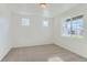 Bedroom features neutral carpet, recessed lighting, and several windows at 771 Sunflower Dr, Brighton, CO 80601