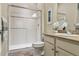 Clean bathroom featuring a glass-enclosed shower, tile accents, and vanity with sink at 22965 E Bailey Cir, Aurora, CO 80016