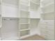 Organized walk-in closet features custom shelves and drawers for ample storage at 22965 E Bailey Cir, Aurora, CO 80016