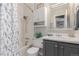 Bathroom featuring shower-tub combo with decorative shower curtain, white cabinets, and vanity at 3541 E 118Th Ave, Thornton, CO 80233