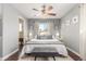 Tranquil bedroom with ceiling fan and natural light provides relaxation in neutral tones at 3541 E 118Th Ave, Thornton, CO 80233