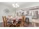 Eat-in kitchen and dining area with seating for six, and view of the kitchen at 3541 E 118Th Ave, Thornton, CO 80233