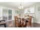 Charming dining room featuring a wood table with seating for four and sliding door access to the backyard at 3541 E 118Th Ave, Thornton, CO 80233