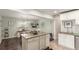 An open-concept kitchen features granite counters, stainless appliances, and a combined dining area at 3541 E 118Th Ave, Thornton, CO 80233