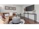 Cozy living room with a comfortable sofa, modern decor, and a mounted television for relaxing entertainment at 3541 E 118Th Ave, Thornton, CO 80233