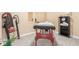 Therapeutic massage room with massage table, inversion table, carpeted floors, and shelving at 3541 E 118Th Ave, Thornton, CO 80233