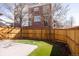 Backyard with fenced yard and green grass at 8806 E 35Th Ave, Denver, CO 80238