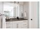 Modern bathroom with granite vanity, contemporary fixtures, and glass enclosed shower at 8806 E 35Th Ave, Denver, CO 80238