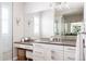 Stylish bathroom featuring a vanity with double sinks, modern fixtures, and glass-enclosed shower at 8806 E 35Th Ave, Denver, CO 80238