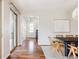 Bright dining area features hardwood floors, modern lighting, and easy access to the outdoors through sliding glass doors at 8806 E 35Th Ave, Denver, CO 80238