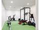 Basement workout area with stationary bike, rowing machine and weightlifting equipment at 8806 E 35Th Ave, Denver, CO 80238