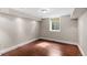 Finished basement area with hardwood floors, recessed lighting, and a window at 172 S Forest St, Denver, CO 80246