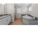 Bright bathroom with soaking tub, glass shower, and modern fixtures at 172 S Forest St, Denver, CO 80246