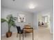 Inviting bedroom features stylish décor, including a cow print and a work desk with a black chair at 172 S Forest St, Denver, CO 80246