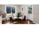 Cozy breakfast nook with table, chairs, bench seating and natural light from the adjacent window at 172 S Forest St, Denver, CO 80246