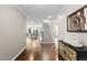 Elegant foyer featuring hardwood floors, a staircase, and an open view to the dining and living areas at 172 S Forest St, Denver, CO 80246