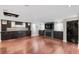 Beautiful living room boasts custom cabinets, fireplace, TV, and hardwood floors at 172 S Forest St, Denver, CO 80246