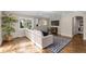 Comfortable living room featuring hardwood floors, large windows and a modern rug at 172 S Forest St, Denver, CO 80246