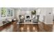 Cozy living room featuring a fireplace, hardwood floors, and comfortable seating arrangement at 172 S Forest St, Denver, CO 80246