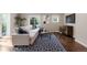 Bright living room with hardwood floors, modern sofa, large window and contemporary decor at 172 S Forest St, Denver, CO 80246