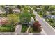 Aerial view of a landscaped home with mature trees along a neighborhood street at 172 S Forest St, Denver, CO 80246