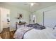 Light and airy bedroom with ceiling fan, hardwood floors and ensuite bathroom access at 8471 Rainbow Ave, Denver, CO 80229