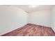 Bedroom featuring wood flooring, neutral walls, a ceiling light, and a closet with sliding doors at 8471 Rainbow Ave, Denver, CO 80229