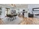 Open floor plan connecting the dining area to the kitchen and living room at 8471 Rainbow Ave, Denver, CO 80229