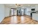 Bright dining area next to kitchen with wood floors and stainless steel appliances at 8471 Rainbow Ave, Denver, CO 80229