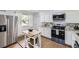 Bright kitchen featuring granite countertops, stainless steel appliances, and a kitchen island at 8471 Rainbow Ave, Denver, CO 80229