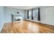 Bright living room features hardwood floors, a decorative fireplace, and large windows at 8471 Rainbow Ave, Denver, CO 80229