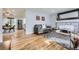 Inviting living room featuring hardwood floors, fireplace, and open layout at 8471 Rainbow Ave, Denver, CO 80229