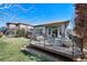 Large deck with seating area and grill overlooking the backyard at 13633 Mariposa St, Broomfield, CO 80023