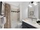 Well-lit bathroom with shower-tub combo, modern fixtures, and tasteful decor at 13633 Mariposa St, Broomfield, CO 80023