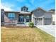 Charming two-story home featuring stone accents, well-maintained landscaping, and a two-car garage at 13633 Mariposa St, Broomfield, CO 80023