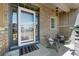 Inviting front porch with stylish seating, stone accents, and a well-lit entryway at 13633 Mariposa St, Broomfield, CO 80023