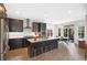 Stylish kitchen with island seating, stainless steel appliances, and abundant natural light at 13633 Mariposa St, Broomfield, CO 80023