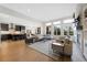 Open living space with fireplace, kitchen with island seating, and bright natural light at 13633 Mariposa St, Broomfield, CO 80023